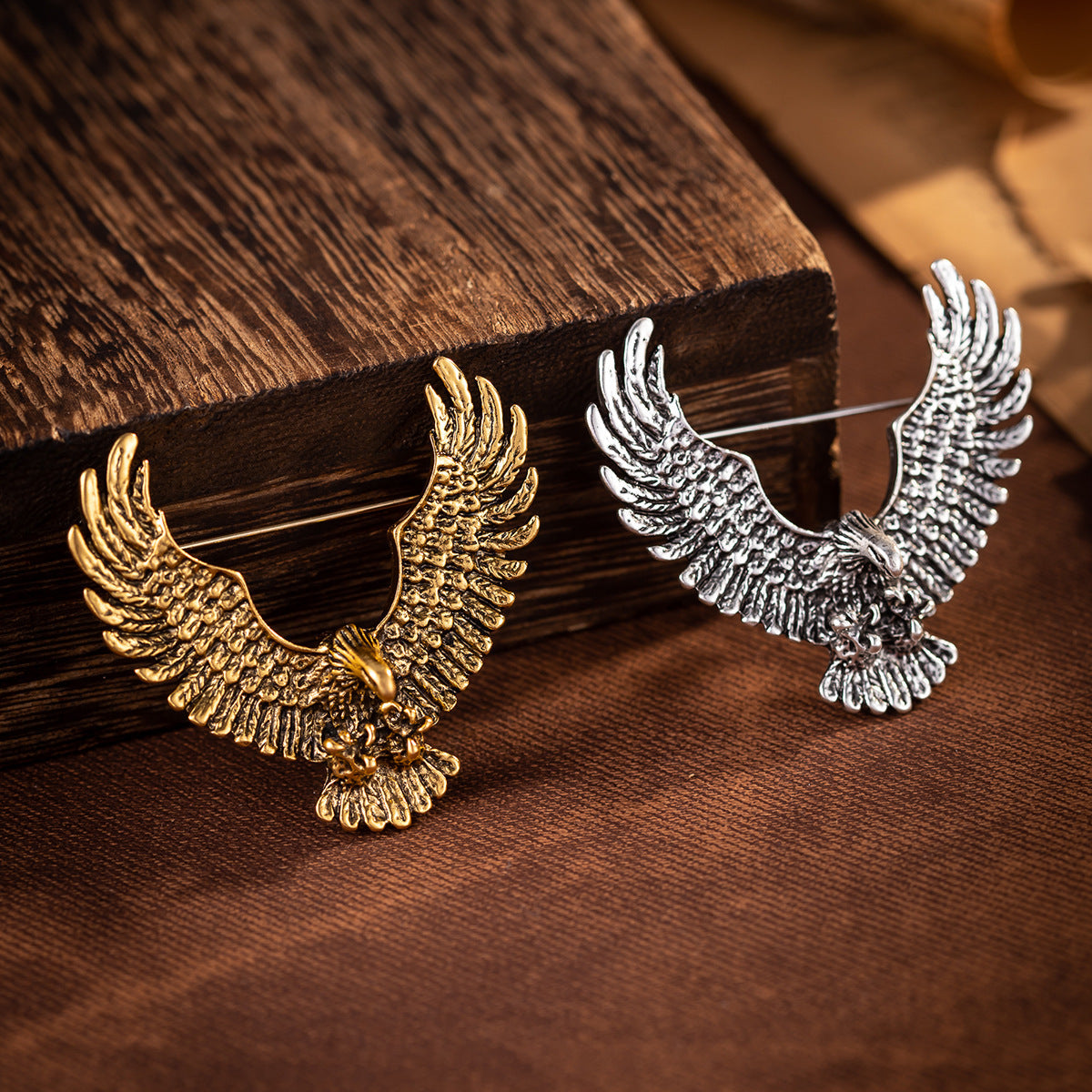 Gold and silver eagle spread-wing badge brooches with pin backs