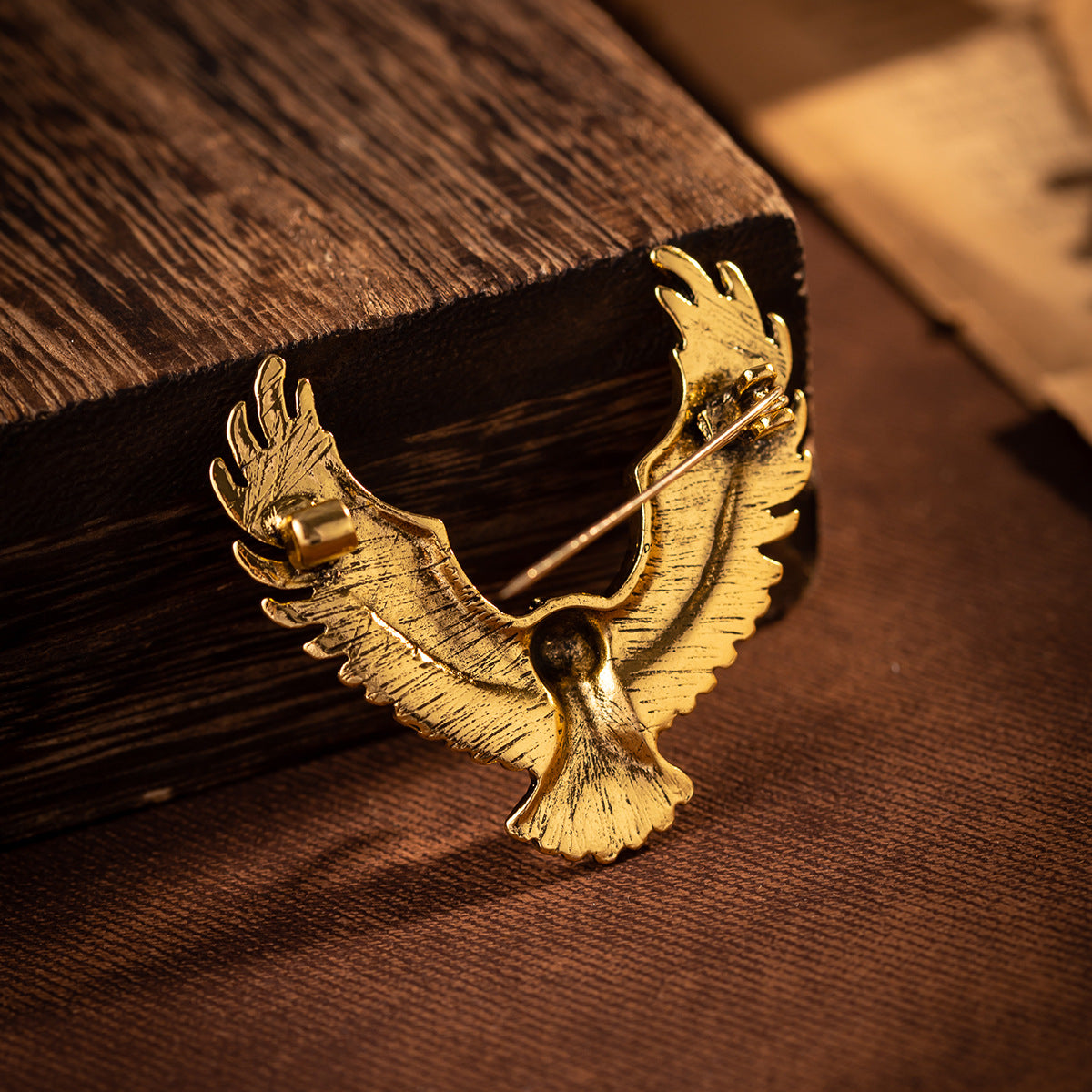 Gold eagle spread-wing badge brooch with pin and clasp hardware