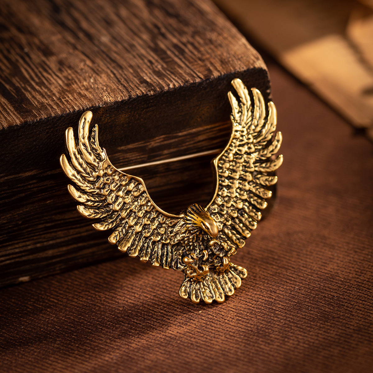 Gold retro eagle spread-wing badge brooch with ornate feather texture