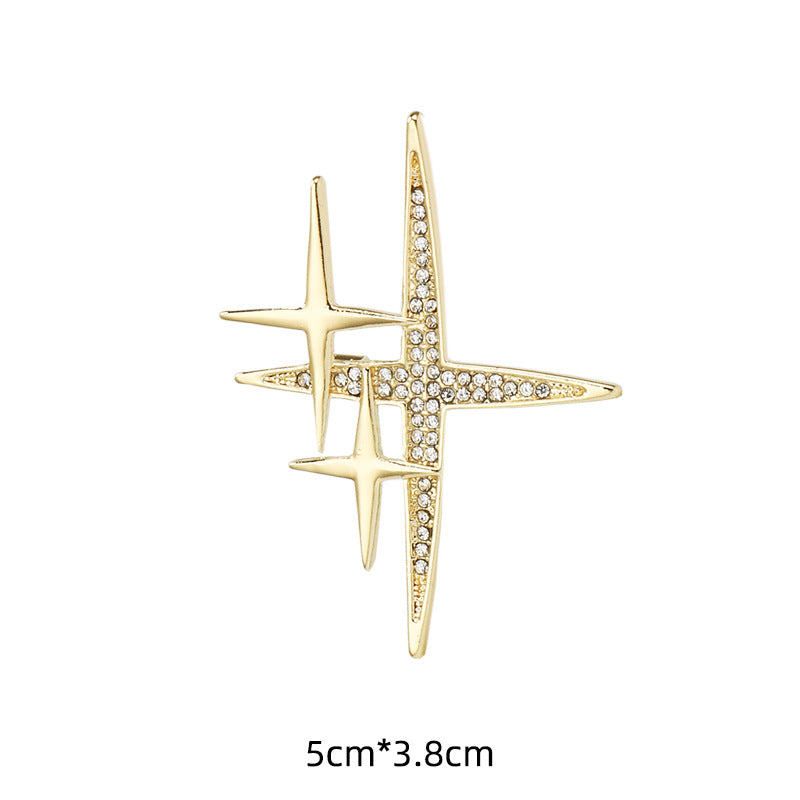Gold cross-shaped starburst brooch pin, rhinestone inlay, 5cm x 3.8cm