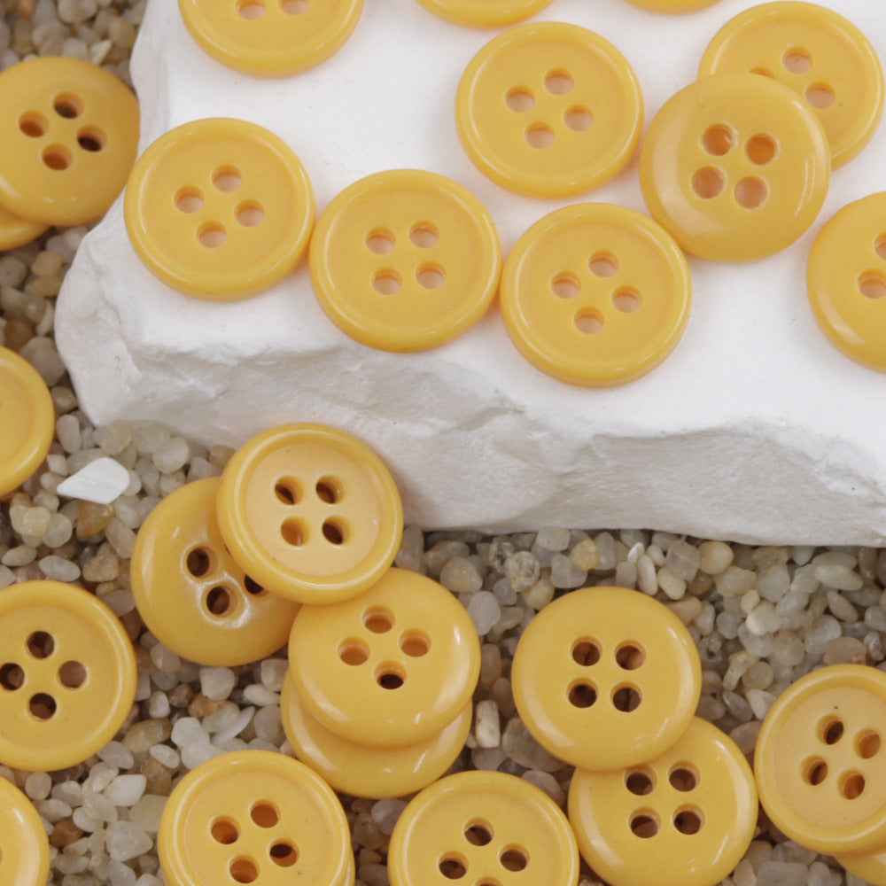 Yellow 4-hole round urea buttons, assorted pieces
