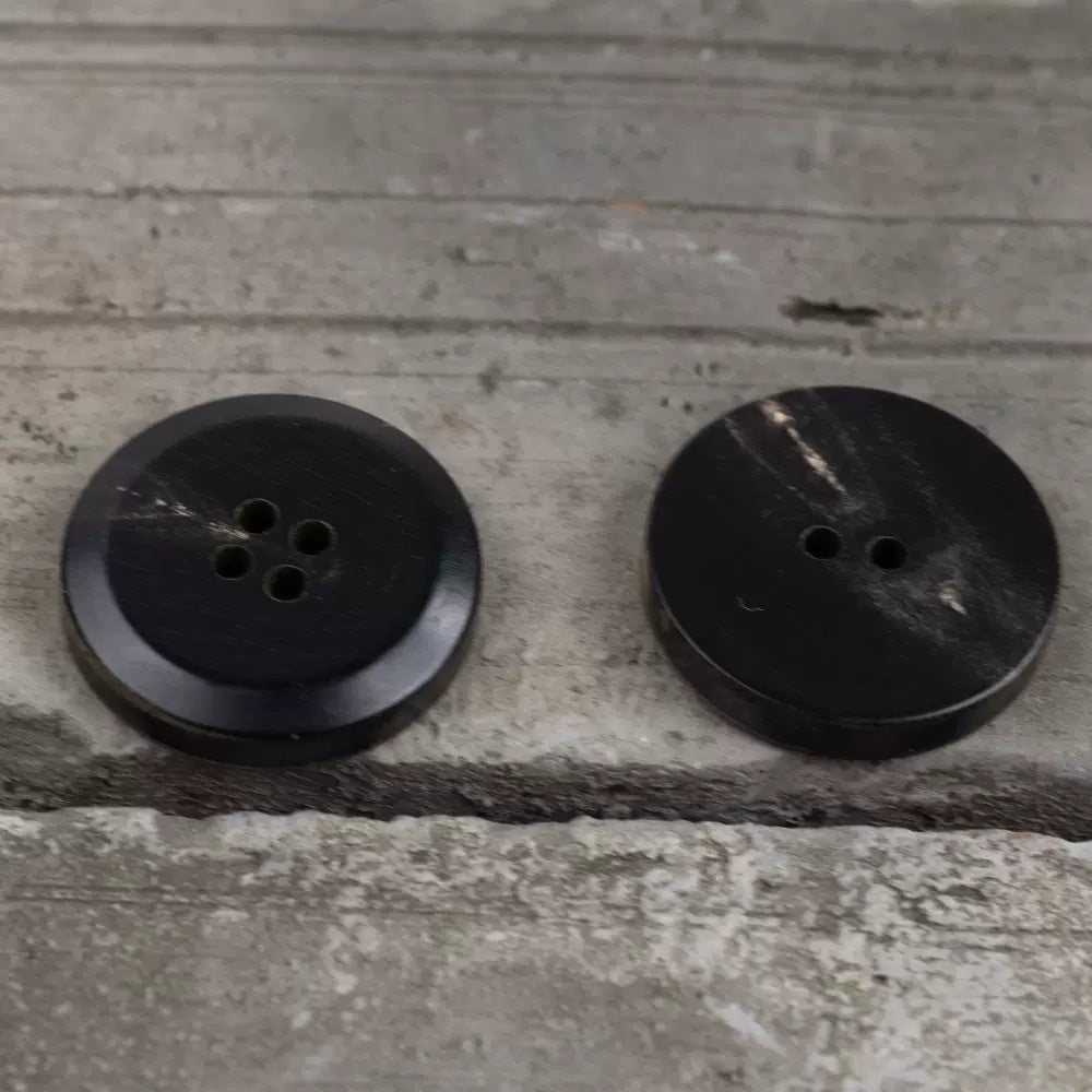 Flat horn-style buttons, dark brown with 4 holes for coat closures