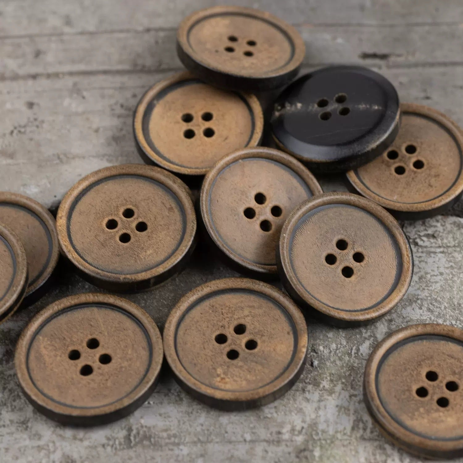 Round flat horn buttons, tan and dark brown, 4-hole cross pattern