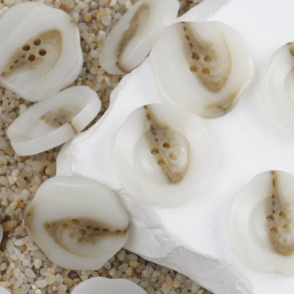 Off-white resin 4-hole buttons, irregular floral pattern