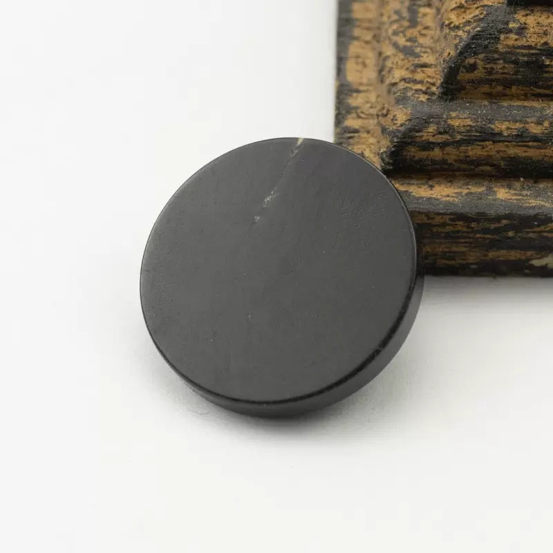 15–30mm flat black real horn button, subtle natural grain, shank back
