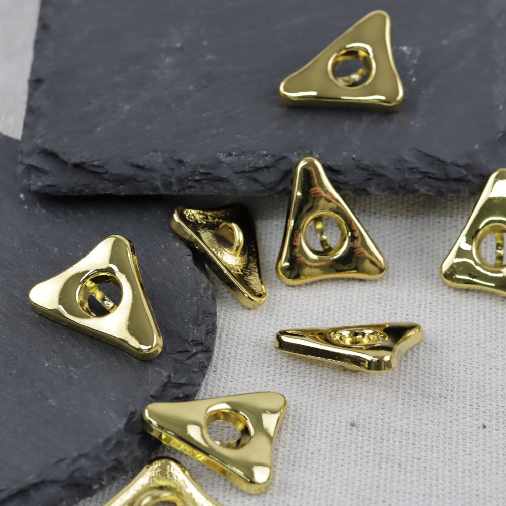 Gold triangular alloy buttons with circular shank openings for hand-sewing garments