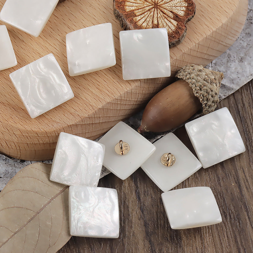 White square pearlized ripple shank buttons with gold loop