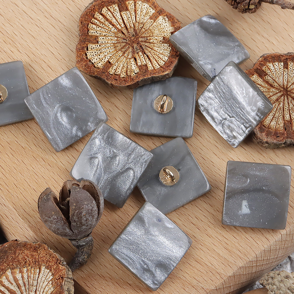 Gray square pearlized ripple shank buttons with gold loop