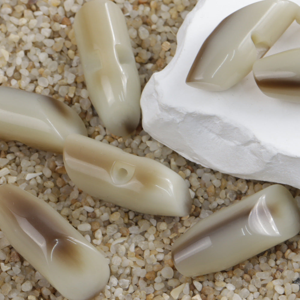 36/50mm resin buttons in beige, teardrop shape with hidden holes
