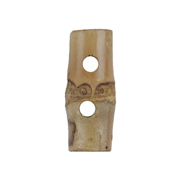 Natural bamboo two-hole toggle button with Chinese knot carving, tan with dark marks