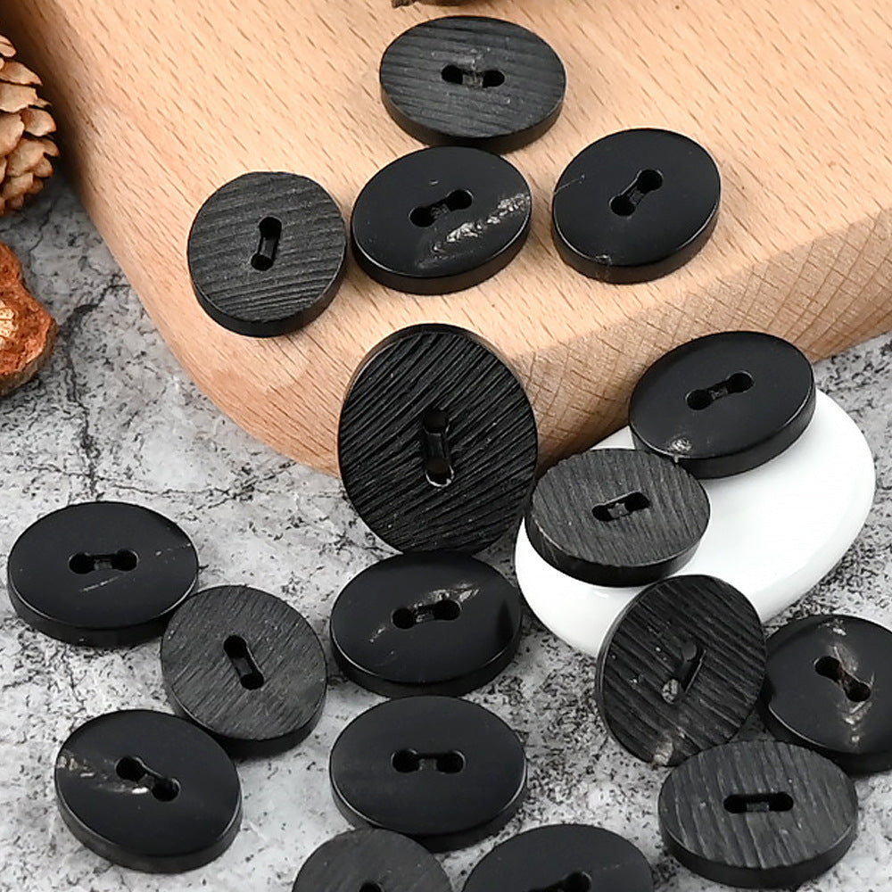 25mm oval 2-hole horn buttons, black, ridged cut texture, set of multiple