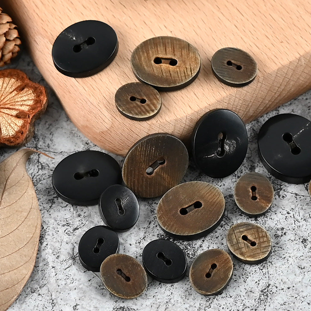25mm oval 2-hole horn buttons, black and burnt tones, assorted sizes, cut texture