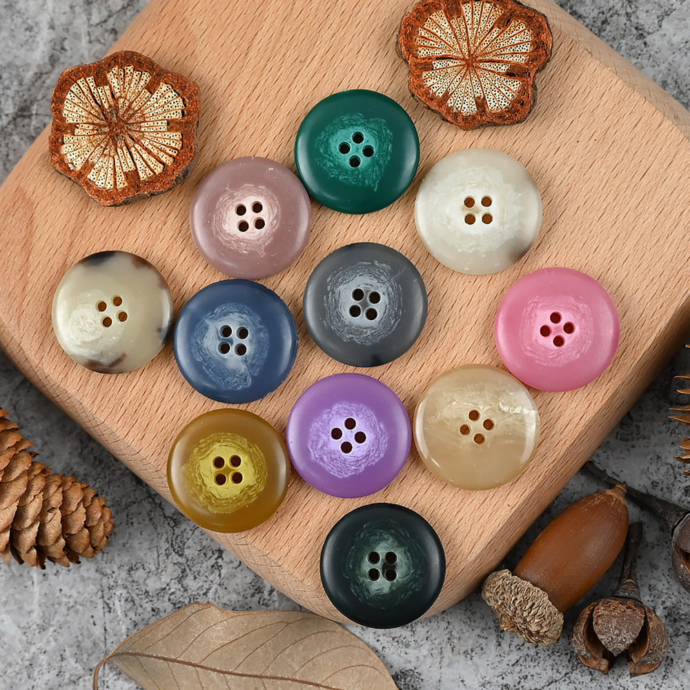 Round 4-hole urea buttons in lavender, teal green, white, navy, charcoal, pink mix