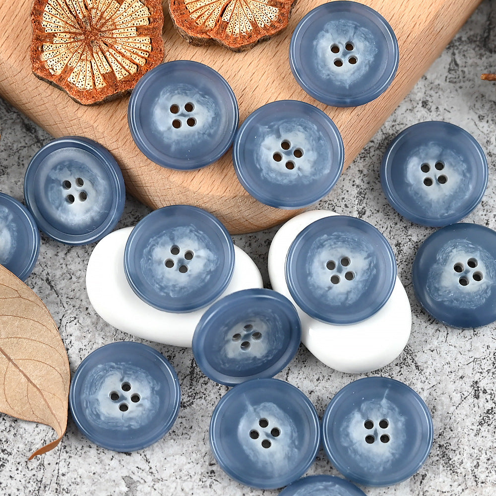 Round 4-hole urea buttons, blue mix with two white buttons in the group