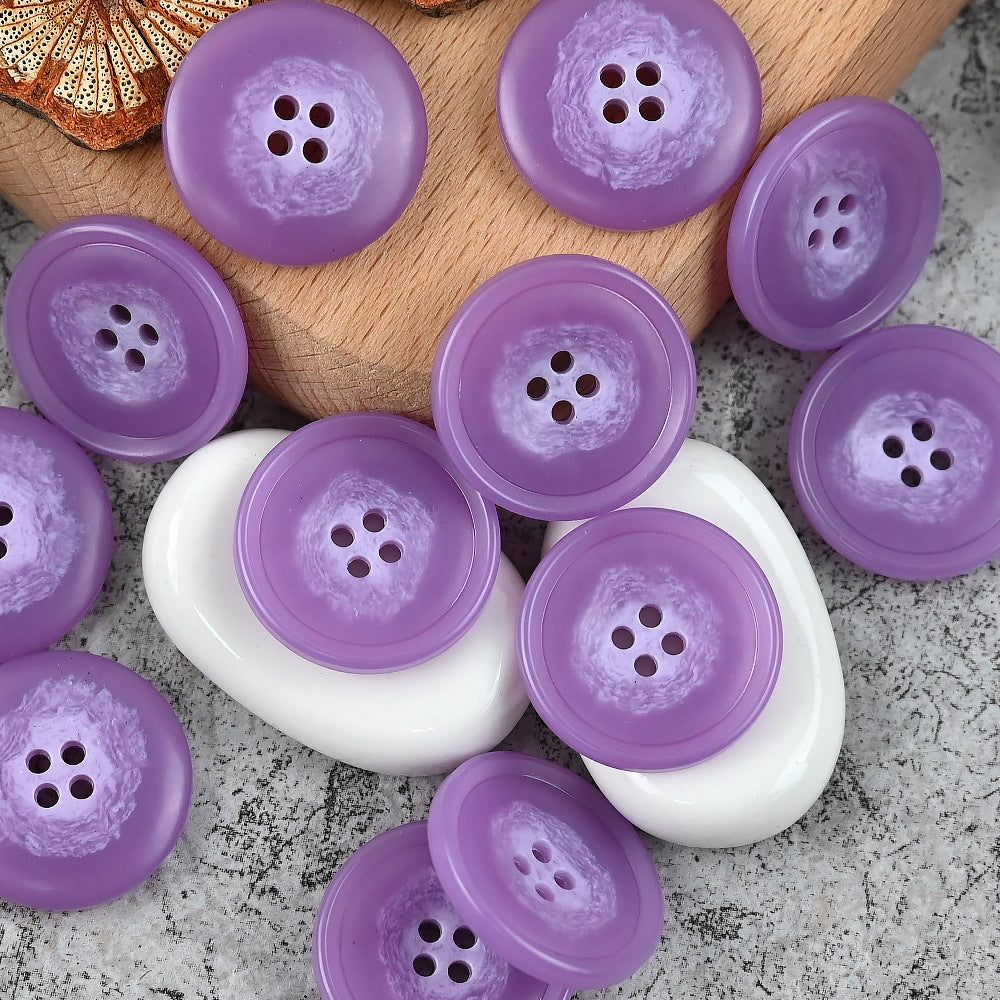 Round 4-hole urea buttons in lavender purple and white with scattered mix pieces