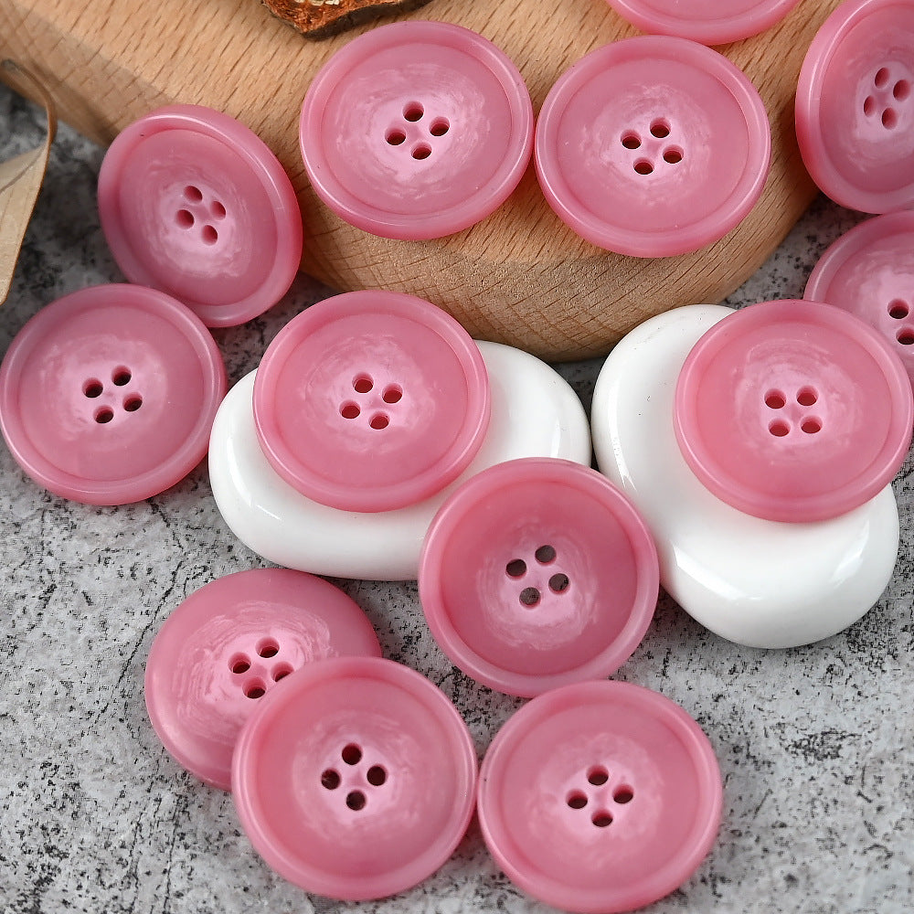 Round 4-hole urea buttons, light pink, smooth glossy surface