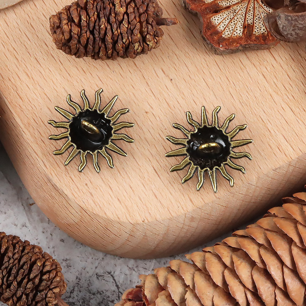 Antique gold sunflower metal shank buttons with black center and brass-colored rim