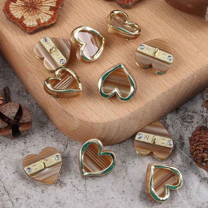 Heart-shaped resin buttons with metal shank, mixed brown, beige, and chrome heart fronts