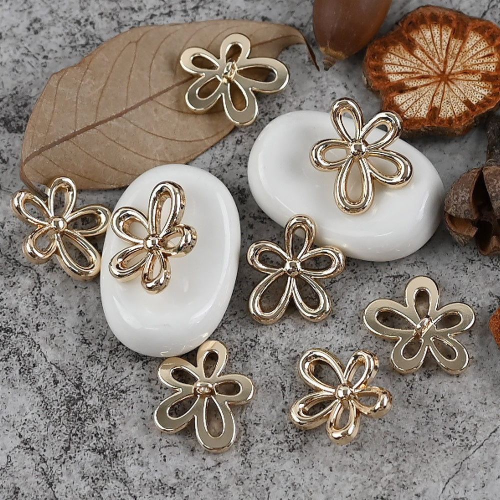 Flower-shaped metal buttons with shanks, gold and silver