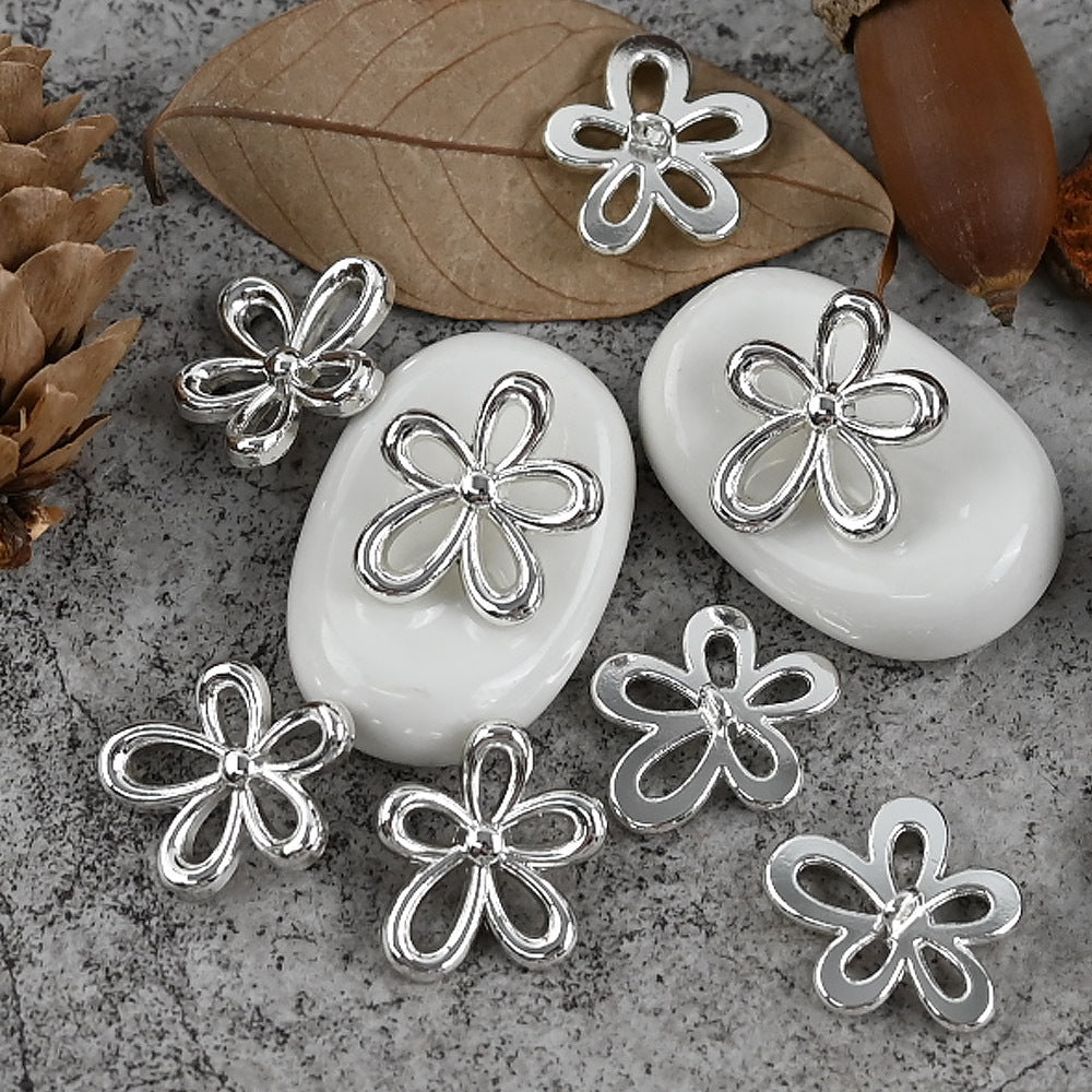 Silver flower-shaped metal button with shank, 18/23mm