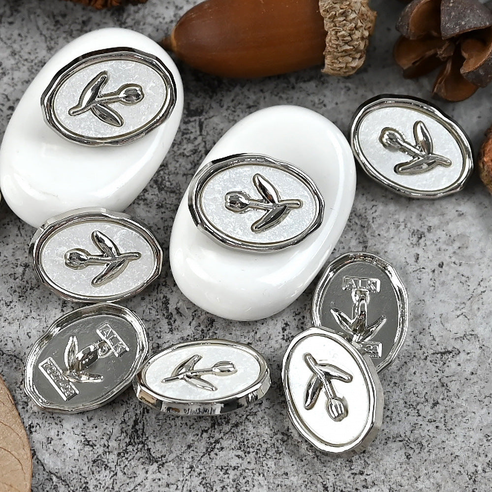Silver-tone tulip oval metal shank buttons, tulip emblems on white oval backs
