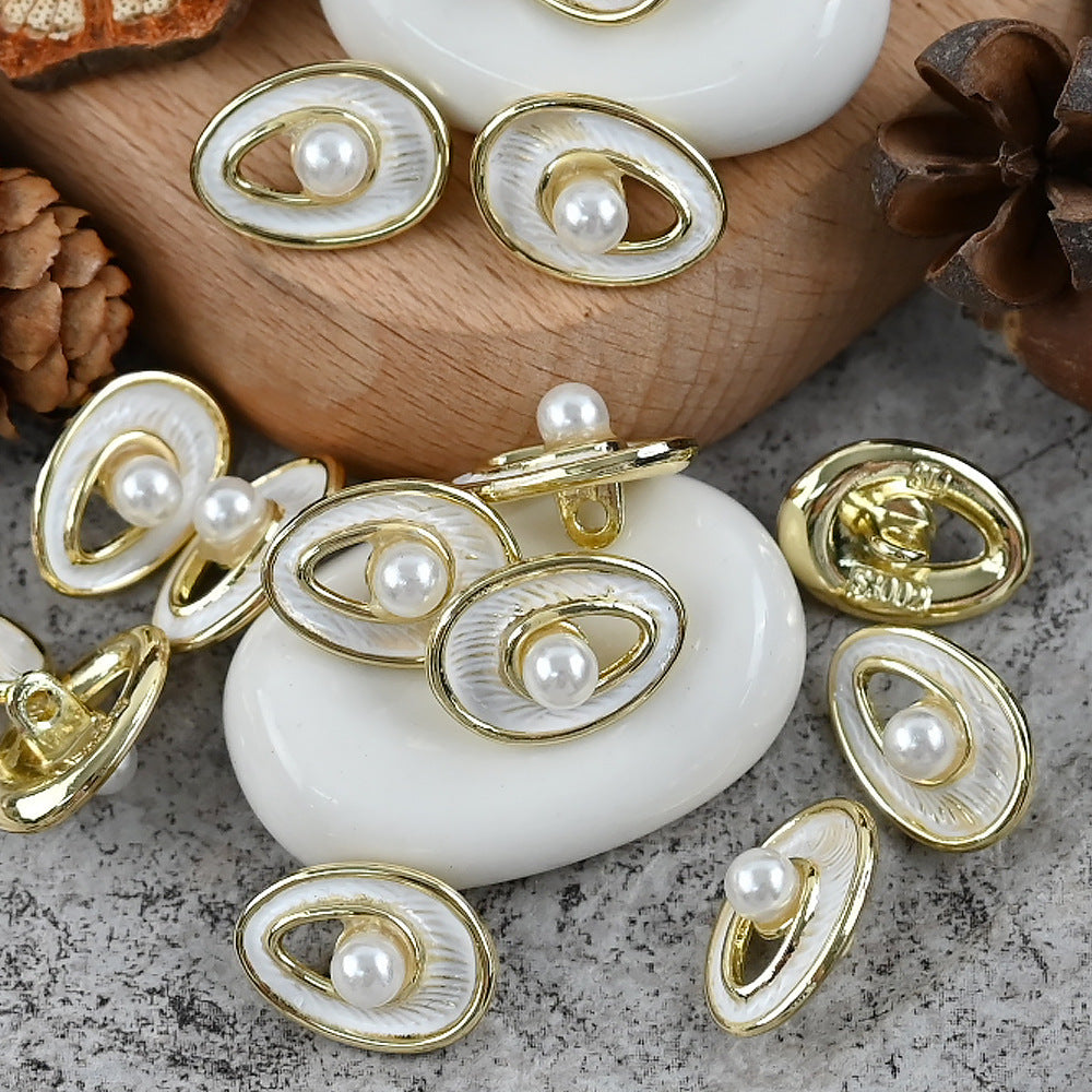 Pearl metal decorative buttons, oval gold edges, white pearl centers with ridged texture