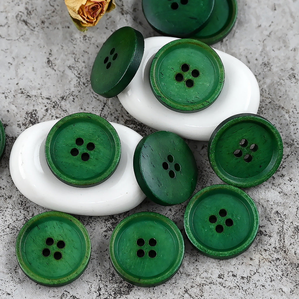 Green round 4-hole cow bone buttons with dark stitching edge, mixed shades