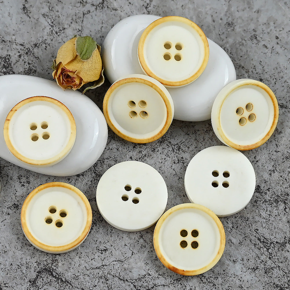 White round 4-hole cow bone buttons with tan rim; vintage style