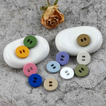 Assorted round 2-hole pig-nose buttons in green, yellow, blue, pink, olive