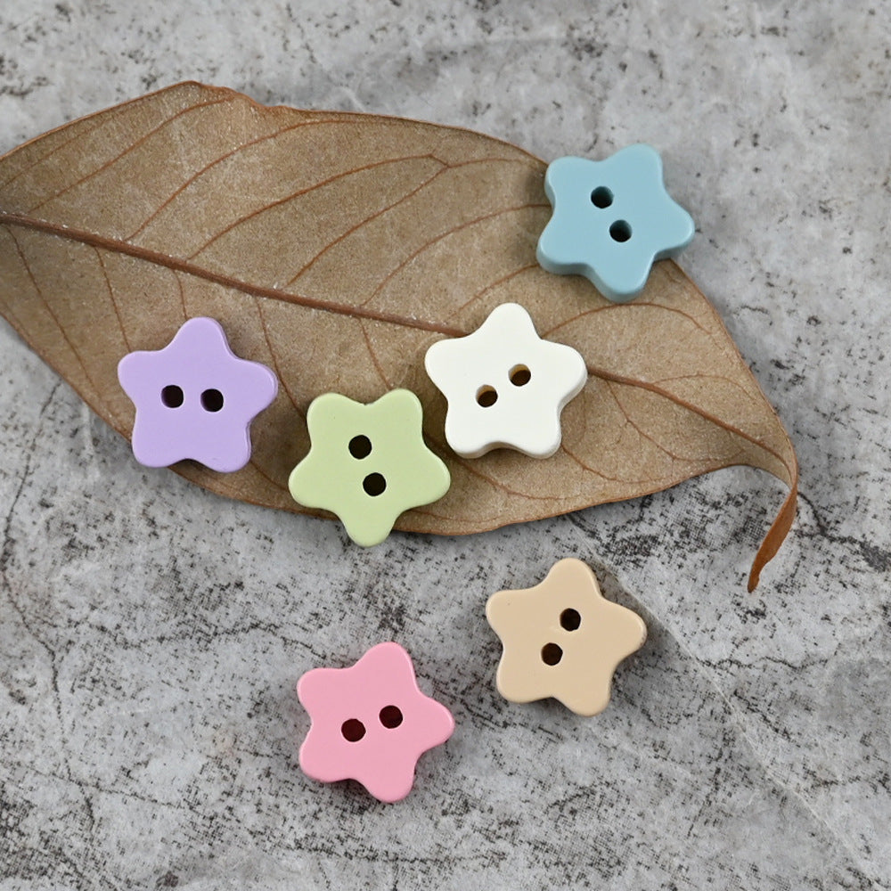 Star-shaped delicate buttons with four holes in sky blue, purple, green, pink and beige