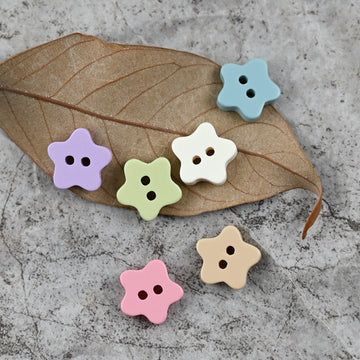 Star-shaped delicate buttons with four holes in sky blue, purple, green, pink and beige
