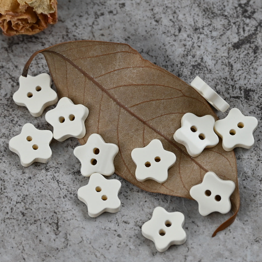White star-shaped delicate buttons with four holes