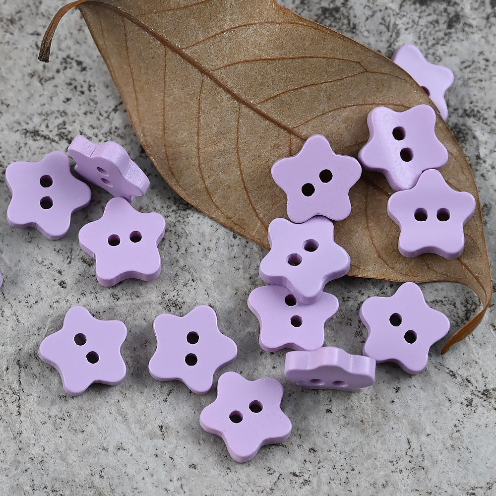 Purple star-shaped delicate buttons with four holes