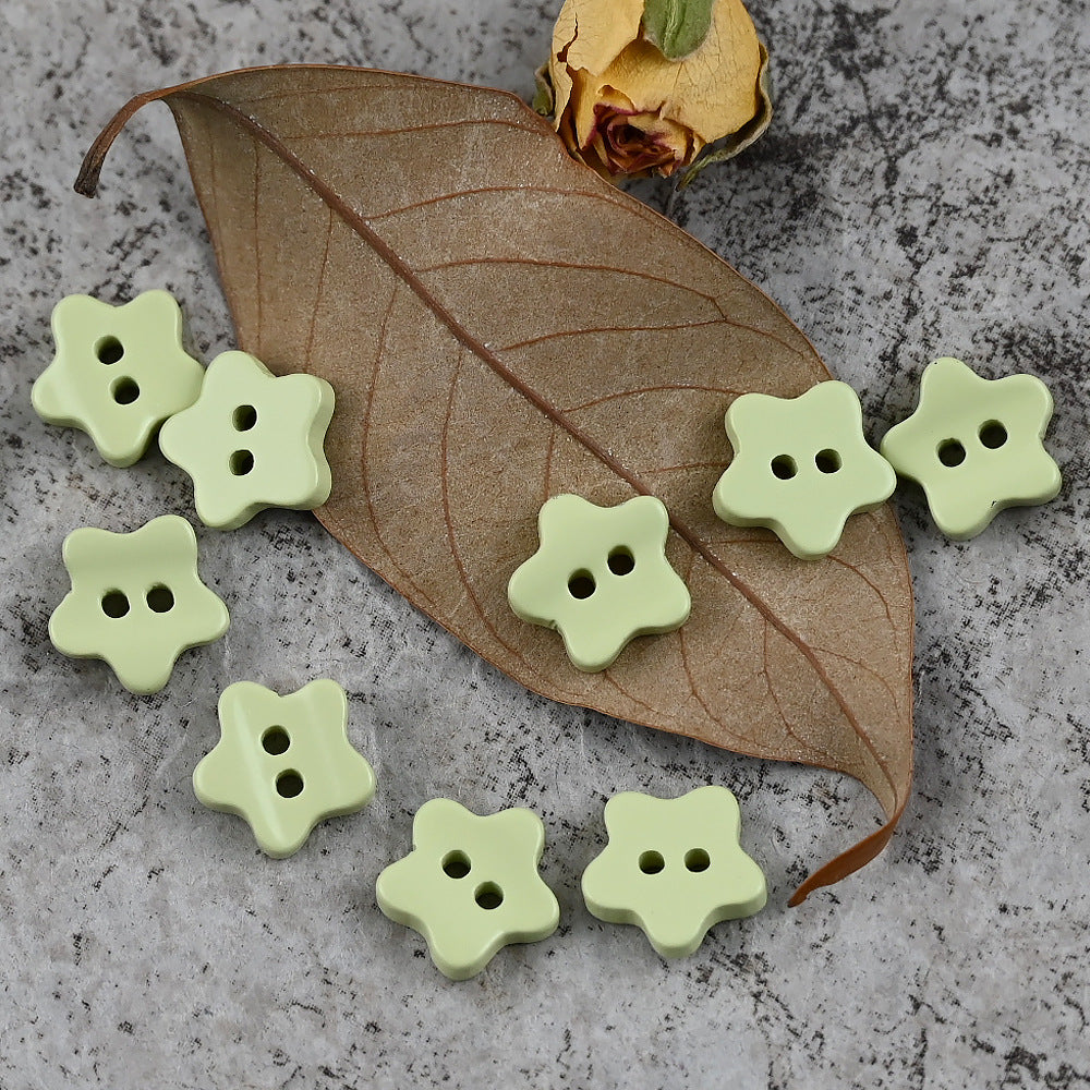 Green star-shaped delicate buttons with four holes
