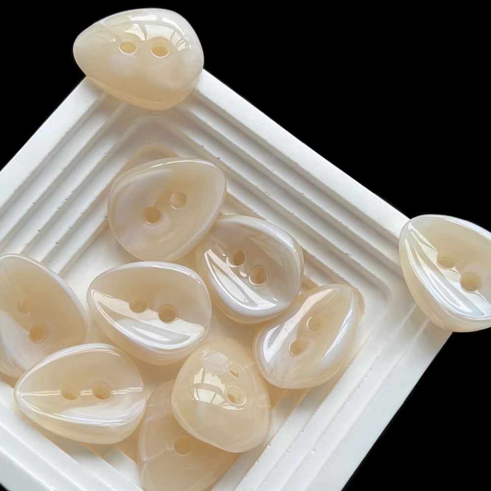 Milky white melon-seed resin button, 2 holes, 23x28mm