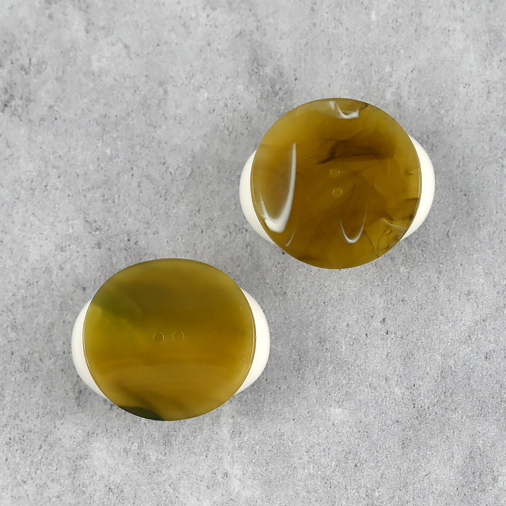 Two 34mm resin buttons with curved surface; yellow to dark green mottled fronts