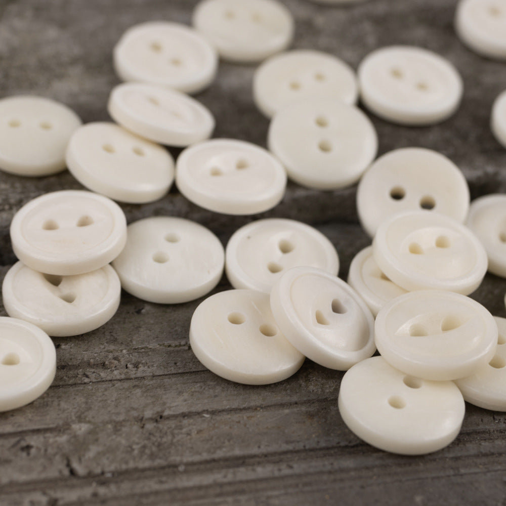 Ivory 2-hole round fish-eye cow bone buttons, 11.5mm, group layout