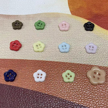Ceramic flower-shaped 4-hole button, dark brown