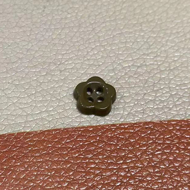 Ceramic flower-shaped 4-hole button, olive brown