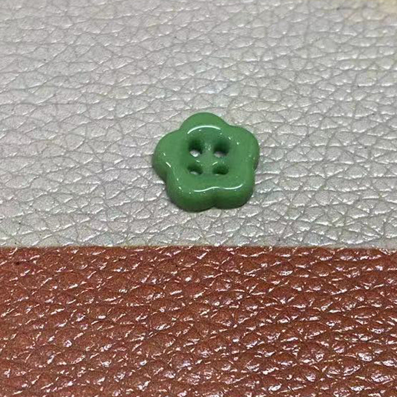 Ceramic flower-shaped 4-hole button, deep green