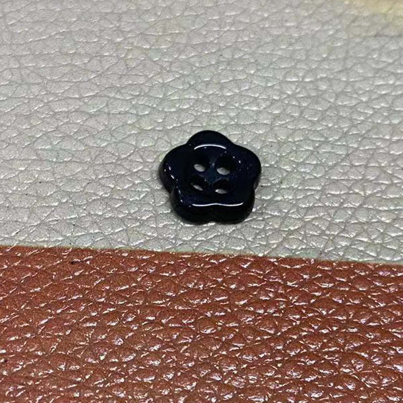 Ceramic flower-shaped 4-hole button, dark navy