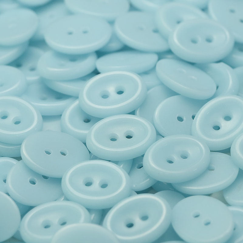 Light blue oval 2-hole ceramic buttons, close-up (50-pack)