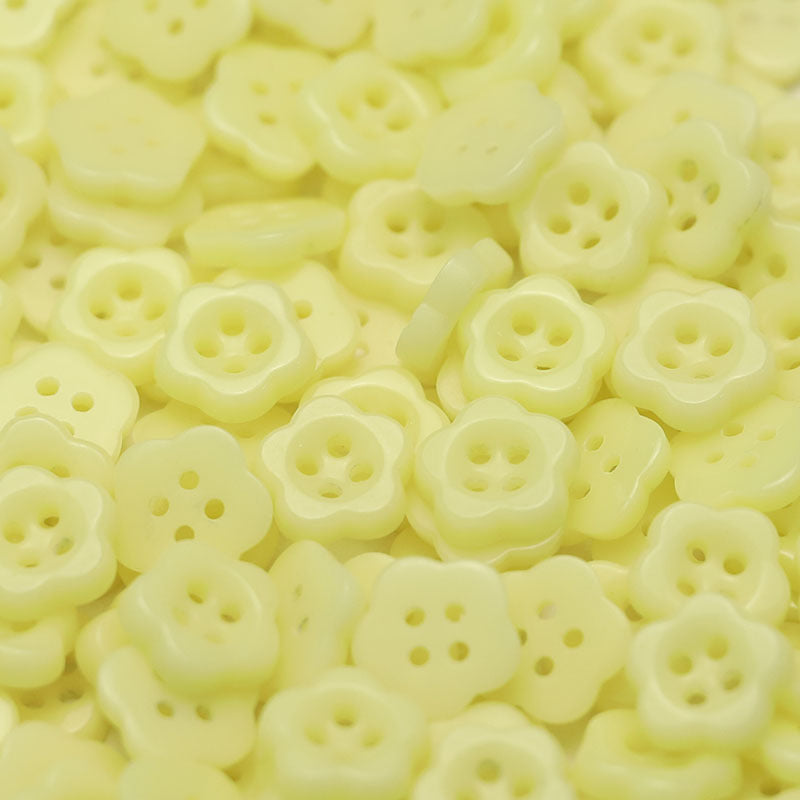 Soft yellow flower-shaped ceramic buttons with four holes for kids clothing
