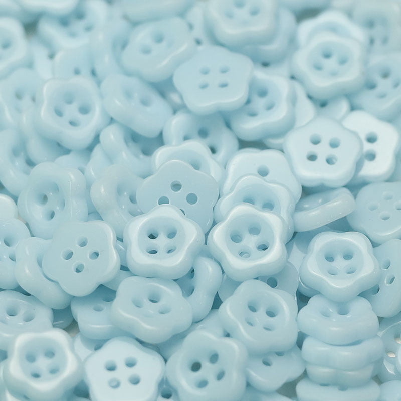 Light blue flower-shaped ceramic buttons with four holes, kids clothing sewing