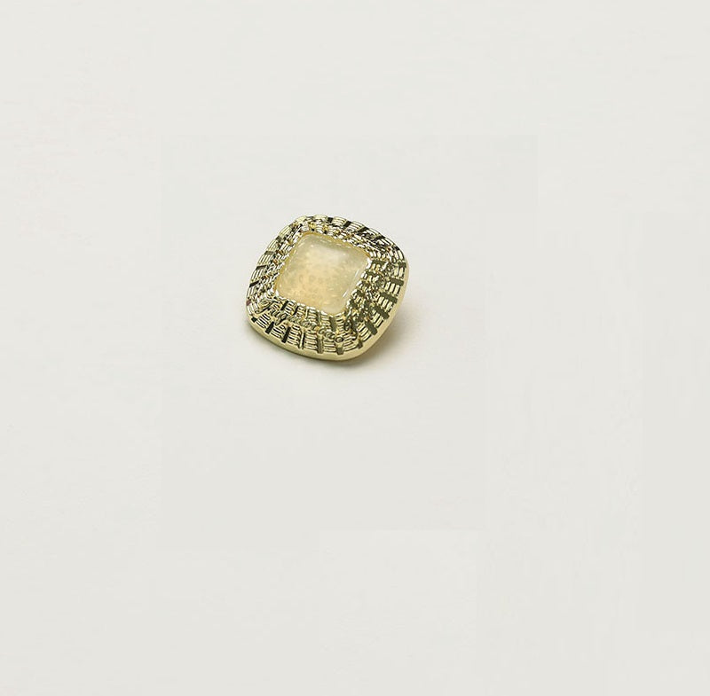 Square gold metal button with cream square insert and ornate rim