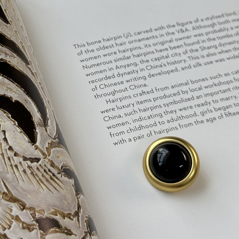 Gold-rim bead clothing button with dark black agate-style center