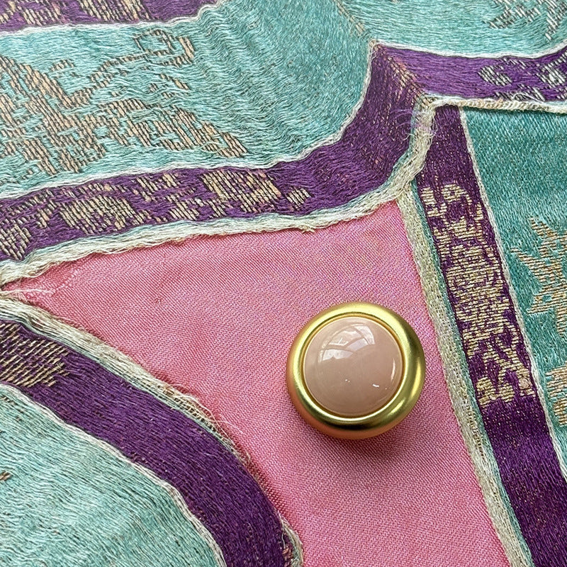 Gold-rim bead clothing button with pink-beige agate-style center