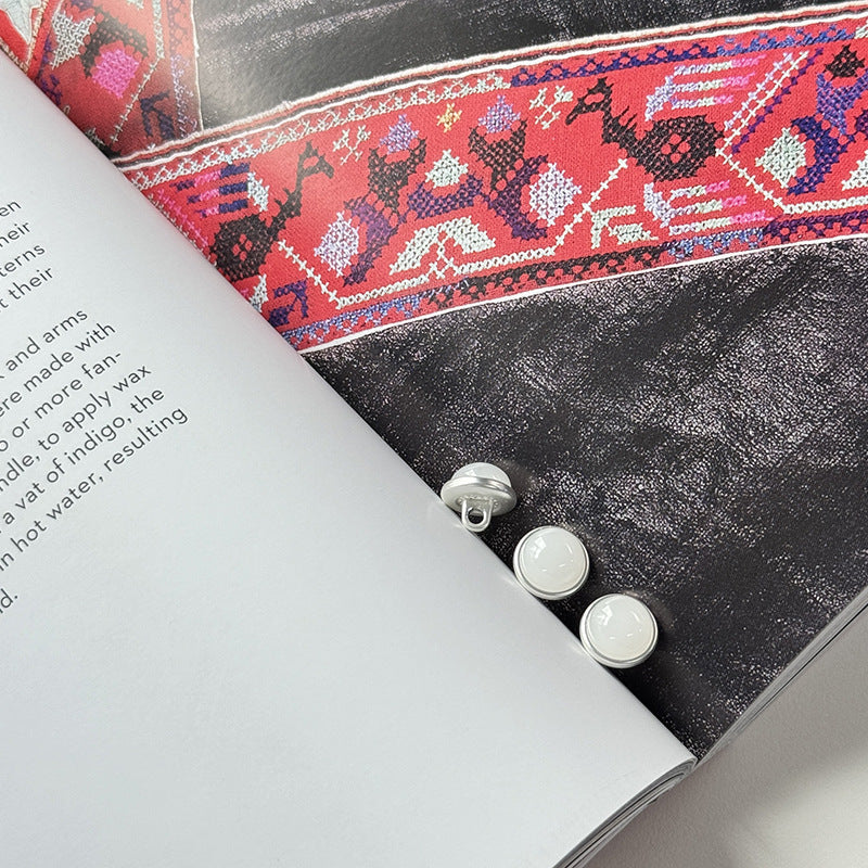 Light gray/white jelly alloy buttons with silver backs and shanks