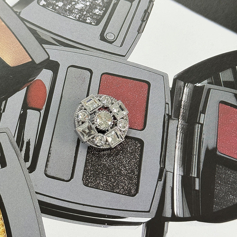 Silver-toned rhinestone metal shank button, round and square cross design