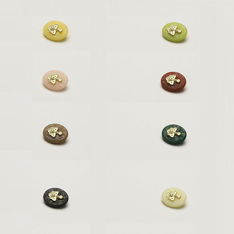 Oval resin clothing buttons set, gold-tone floral motif, assorted light to dark colors